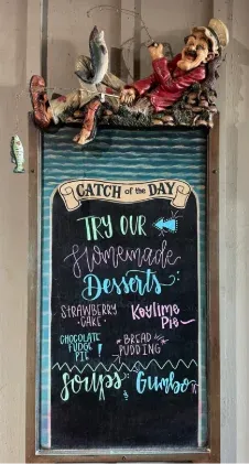 Catch of the Day chalkboard and homemade desserts menu at The Docks